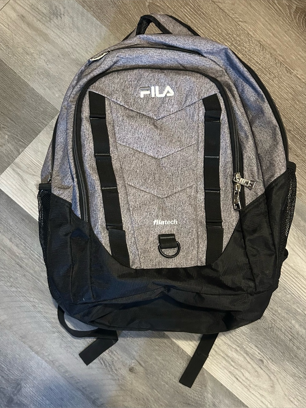 Fila gray and black zip up backpack